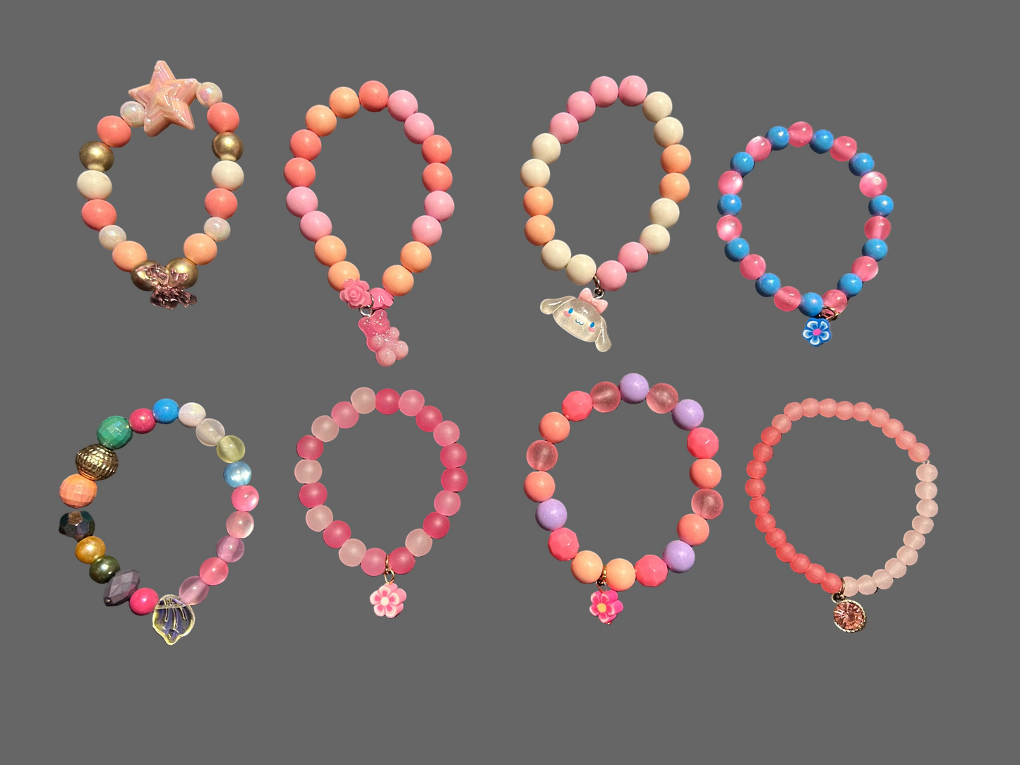 Set of colorful beaded bracelets on a dark surface