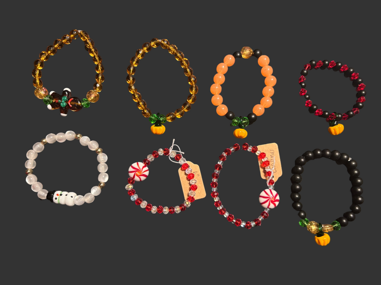 Collection of beaded bracelets on a dark surface